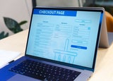 A laptop displaying a checkout page