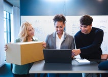 Women with packaging, talking to colleagues