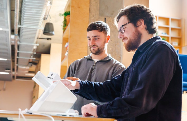 The Senior Research Executive and Reviews Writer testing a POS terminal