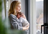 Woman holding a newborn baby