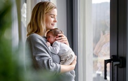 Woman holding a newborn baby