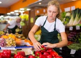 Teenager working in a grocery shop