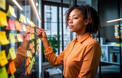 Business owner making notes and revising goals and structure