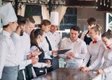 Team of restaurant staff having a meeting